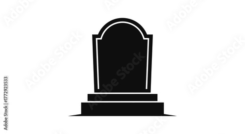 A stark black silhouette of a traditional gravestone with a rounded top and a multi tiered base isolated on a white background silhouette