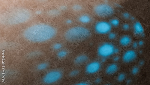 Light and shadow create an abstract pattern on a wall surface