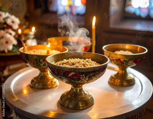 Close-up of bowls with steaming food, candles, and flowers inside a warmly lit religious building