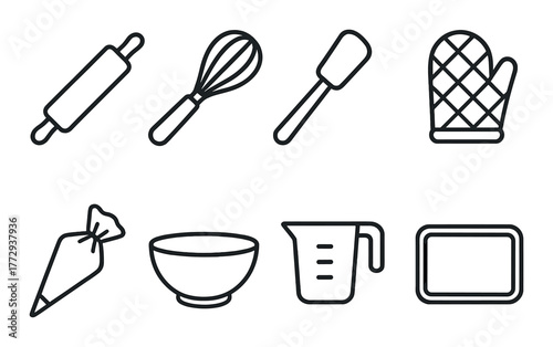 Kitchen utensils on dark wooden background: whisk, rolling pin, oven mitt, measuring cup