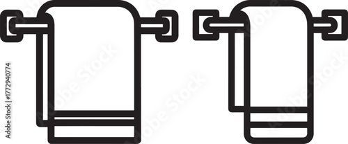 Two towels hanging on wall mounts silhouette