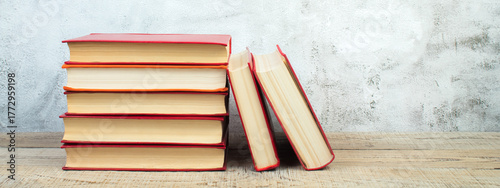 open book, books on the gray concrete background. Back to school. Education. Copy space for text. Banner.