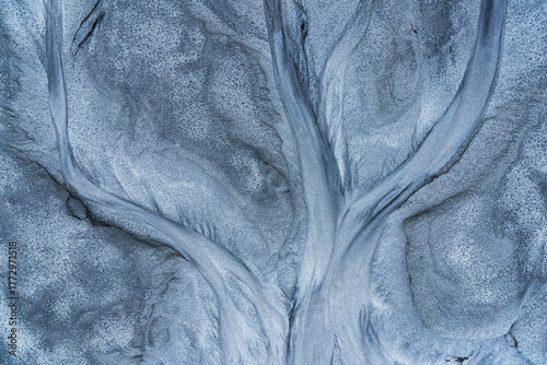 Abstract design resembling branches on gray surface