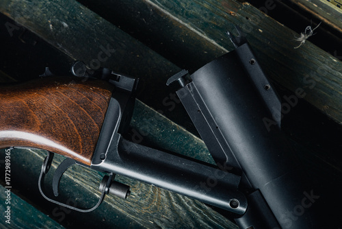 vintage firearm with rustic charm, artistic scene of antique hunting rifle on weathered surface