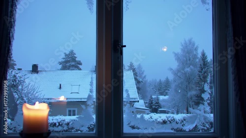 Candle Burning at Snowy Window Winter Scene