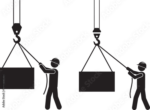 Workers guiding a suspended load with ropes and a crane hook