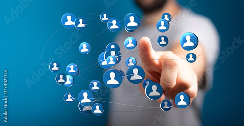 Wallpaper Mural Person's finger interacting with a network of digital people icons, representing social connections, global networking, and collaborative projec Torontodigital.ca