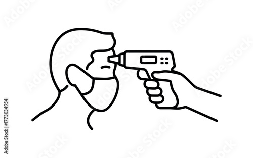 A person wearing a mask is having their temperature taken with an infrared thermometer.