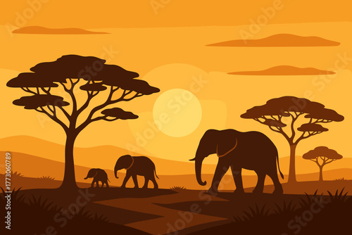 Elephants walking through savanna at sunset