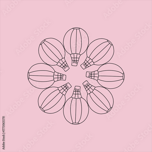 Hot air balloons arranged in a circle on a pink background creating a floral pattern design