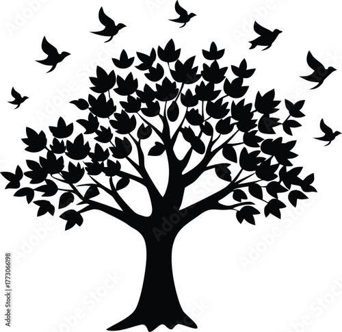 A Silhouette of a Majestic Tree with Birds Taking Flight