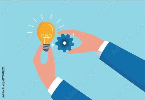 Implement business idea, development process or project implementation, new innovation, optimization or solution concept, businessman hand holding lightbulb idea implementing cogwheel to make it work.