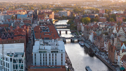 Obraz na plátně Aerial view of Gdansk Old Town along Motlawa River at sunset