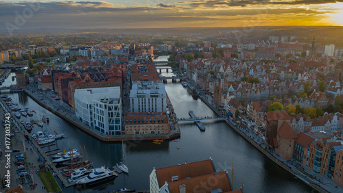 Aerial golden hour over Gdansk Old Town and Motlawa with Zuraw