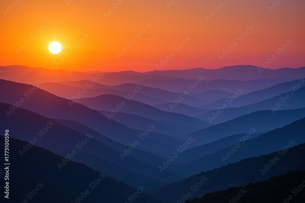 Obraz premium Smoky mountain ridges at sunset layers of mist and blazing pastel sky above