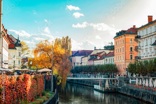Colorful autumn cityscape with river and old European buildings. Ljubljana, Slovenia