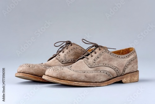 Elegant Suede Brogue Shoes Classic Footwear Isolated on Neutral Background, Fashion Concept