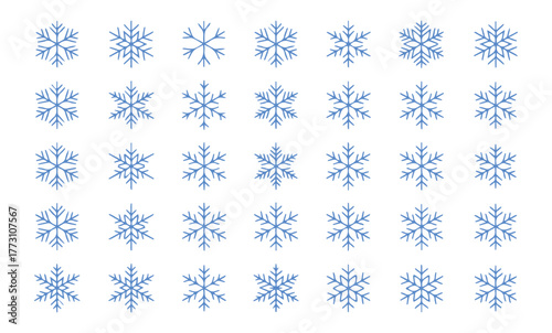 Delicate snowflakes in shades of blue shimmering with frosty elegance, perfect for winter holiday designs and creating a magical seasonal atmosphere