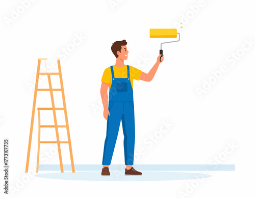 A man in blue overalls and a yellow shirt is painting a white wall with a yellow paint roller. A wooden ladder stands nearby.