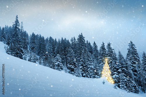 Christmas background with golden fir tree in a winter forest.