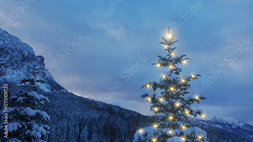 Christmas background with glowing pine tree in a winter mountains.
