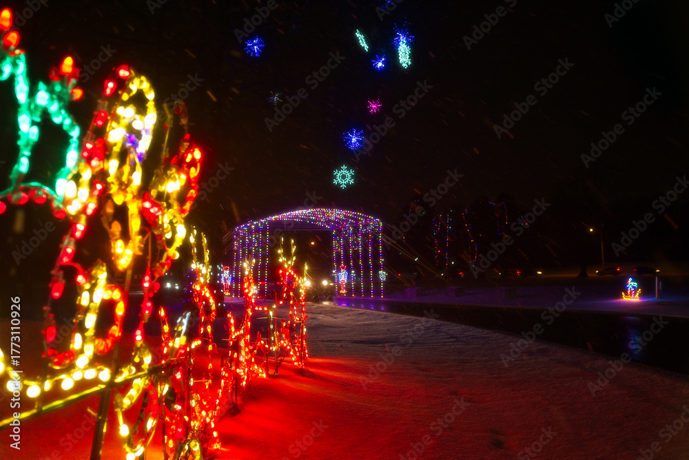 Fototapeta premium A colorful tunnel of lights serves as the entryway to a northeast Ohio city park Christmas lighting display.