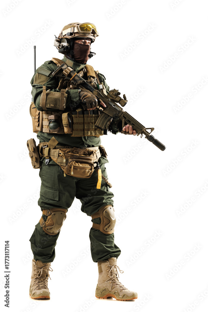 Obraz premium Military personnel dressed in modern tactical gear holding a weapon isolated on a white background.