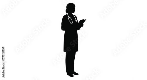 Silhouette of a female doctor reading from a digital tablet