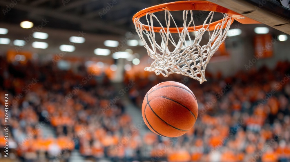 Fototapeta premium Basketball about to go through the hoop during a game