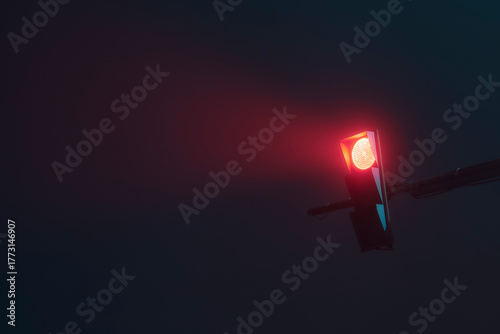 Traffic light on a foggy night