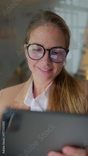 Professional woman using tablet in modern office
