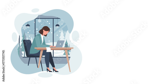 Professional woman working on laptop with snowy winter landscape outside