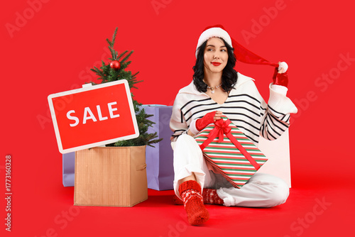 Pretty young woman in Santa...