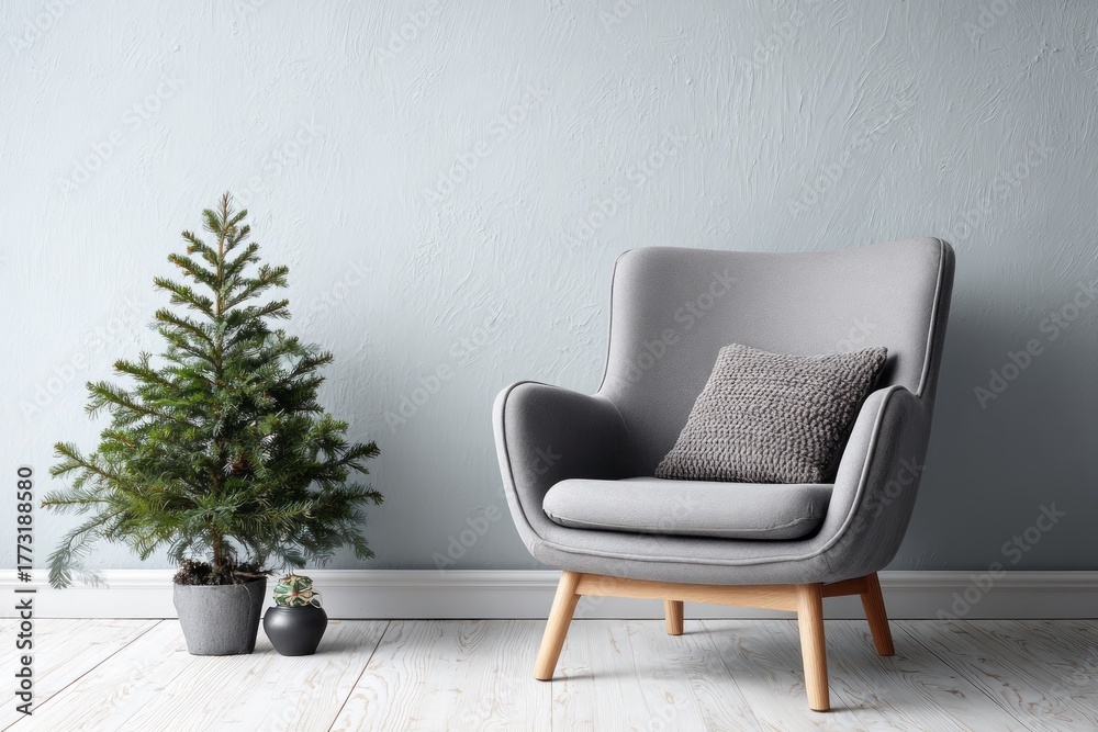 Fototapeta premium Minimalist home interior with a small evergreen tree and armchair.