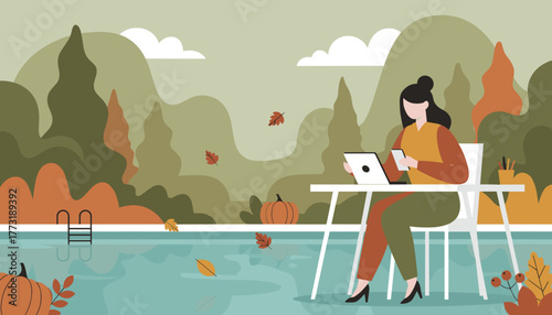 Woman working remotely on laptop by an autumn pool enjoying the digital nomad lifestyle