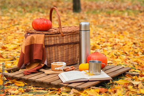Basket with book, cup of te...