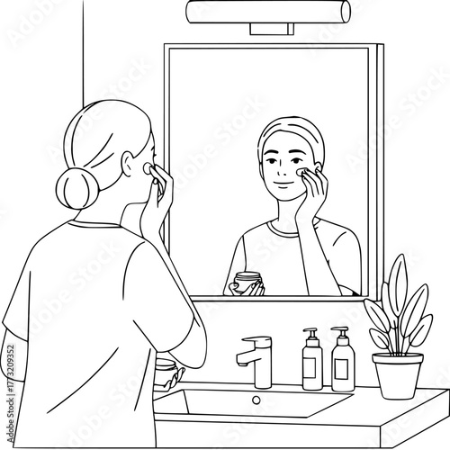 Woman applying skincare cream for a radiant, youthful glow in home bathroom