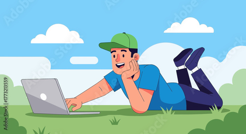 Relaxing Man on Grass with Laptop in Nature on a Sunny Day is Studying