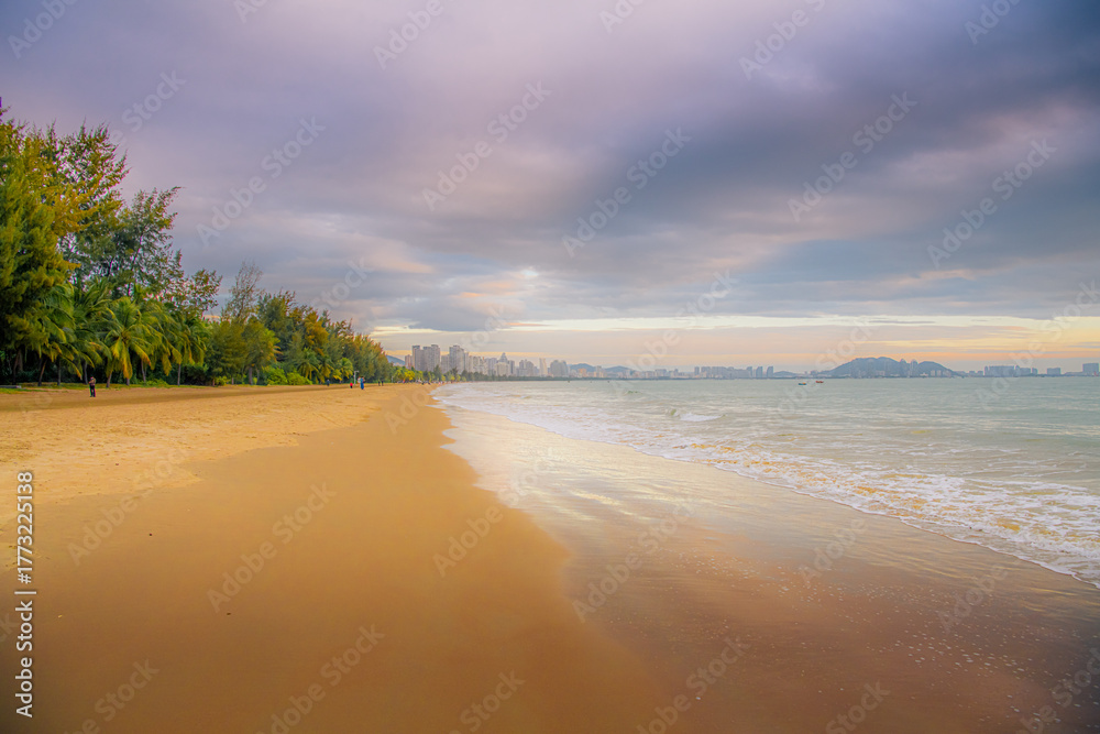 Fototapeta premium Gorgeous beach lined with palm trees near Sanya