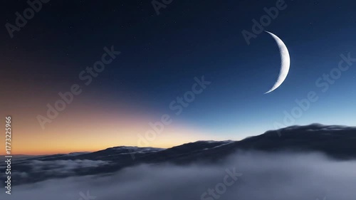 Spectacular crescent moon over cloud-covered mountains, illuminated by the twilight and a gradient sky, a serene and calming landscape