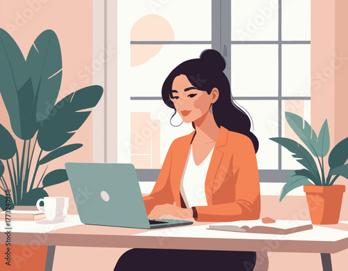 Woman working on laptop at desk