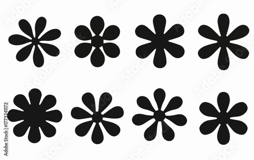 A collection of diverse black floral or asterisk-like vector shapes, each featuring unique petal counts for versatile design applications.