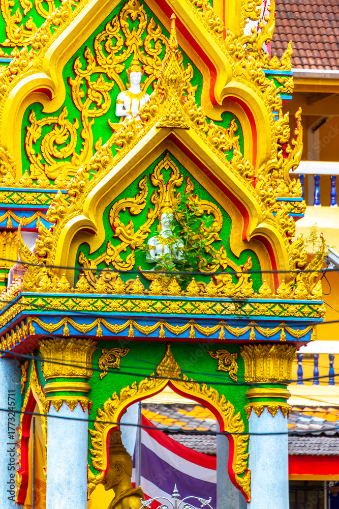 Fototapeta premium Suwankeereewong Temple wat golden Buddhist architecture details in Patong Thailand.