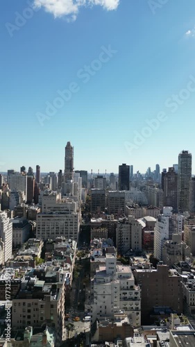 Aerial pan from left to right across Manhattan skyline above Central Park