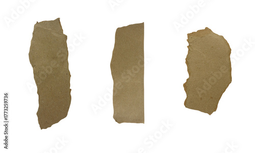 Cut pieces of cardboard paper with white backing, isolated on a plain surface. The paper pieces appear as scrap materials often used for craft or art projects.