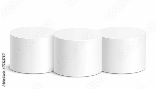 Three white cylinder podiums against a white background (1)