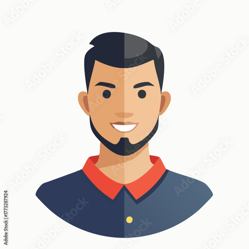 Young man with a beard and a smile looking at the camera.