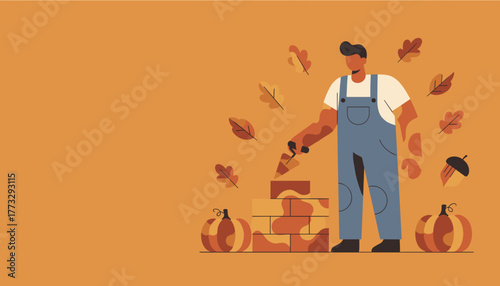 Mason building a brick wall in autumn with pumpkins and fall leaves Construction season concept