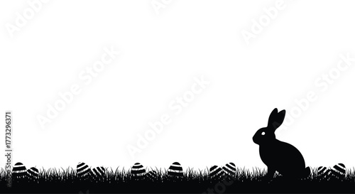 Easter bunny and striped eggs in a grassy field, depicted as black silhouettes against a clean white background, creating a festive spring holiday illustration.