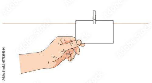 Hand holding blank square card with clothespin on string mockup for message or reminder note design concept